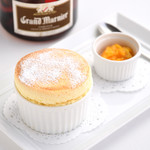 Brasserie PAUL BOCUSE - 季節限定「オレンジ香るスフレ」　グランマニエを合わせた大人のデザート