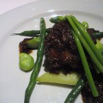 コポンノープ - 岩手県産地鶏のワイルドライス包み焼き　牛蒡ソース