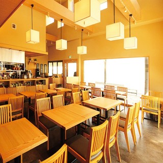 Spacious table seating with high ceilings, allowing for easy arrangement of seating combinations!