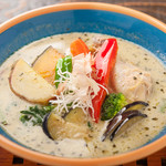 Yellow curry with bone-in chicken and plenty of vegetables