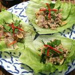 Minced pork dressed with lemongrass and wrapped in lettuce "Yam Moo Takrai"