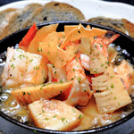 Bamboo shoots and shrimp simmered in oil (Ajillo) served with bamboo charcoal baguette