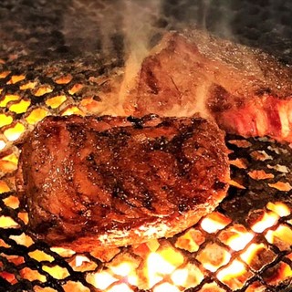 ``Proud Kuroge Wagyu Beef'' is slowly grilled over charcoal.