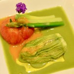 Zucchini flower phallus, oven-roasted tomatoes and asparagus coulis