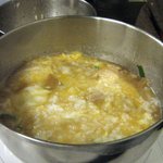冨じお - 無料サービスの玉子を入れれば玉子雑炊の完成
