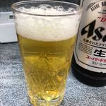 Chuukaryouri Marutsuru - 濃すぎる味のチャーハンに負けそうになったらこの温い大瓶ビール700円（推定価格）を頼むべきだと思います。はなっから頼むのもアリですね。