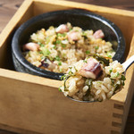 Octopus and mustard greens on hot stone rice with garlic