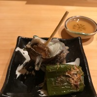 鮨 つきうだ - 万願寺唐辛子のお浸し　姫さざえ