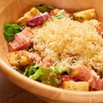 Caesar salad with smoked cheddar cheese and thick-sliced bacon