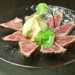 Wagyu beef carpaccio with vinegar and soy sauce foam