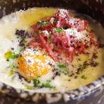 Top quality marbled wagyu beef and truffle egg yolk stone grilled risotto