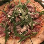 Prosciutto, arugula and parmesan pizza