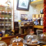 ブラック - ピンボケですいません。　手前はケーキ、奥の右から焼酎一升瓶、クッキー、コーヒー豆