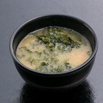 Miso soup with green lettuce