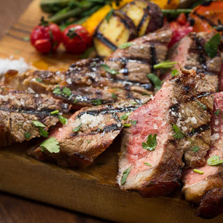 Charcoal-grilled T-bone Steak aged in-house for 40 days.