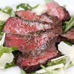 Char-grilled beef tagliata with arugula and parmigiano