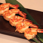 Grilled plump shrimp skewers