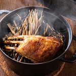 Dutch oven-roasted bone-in lamb with straw smoked finish