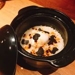 Truffle egg fried rice cooked in a clay pot