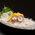 Live octopus sashimi
