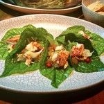 Nahm - Miang of lobster, chicken, green mango, snakefruit, and herbs served on a betel leaf