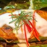Nahm - Grilled Banana leaf packet of blue swimmer crab, wild prawn and red grouper fish seasoned with wild ginger and red curry paste